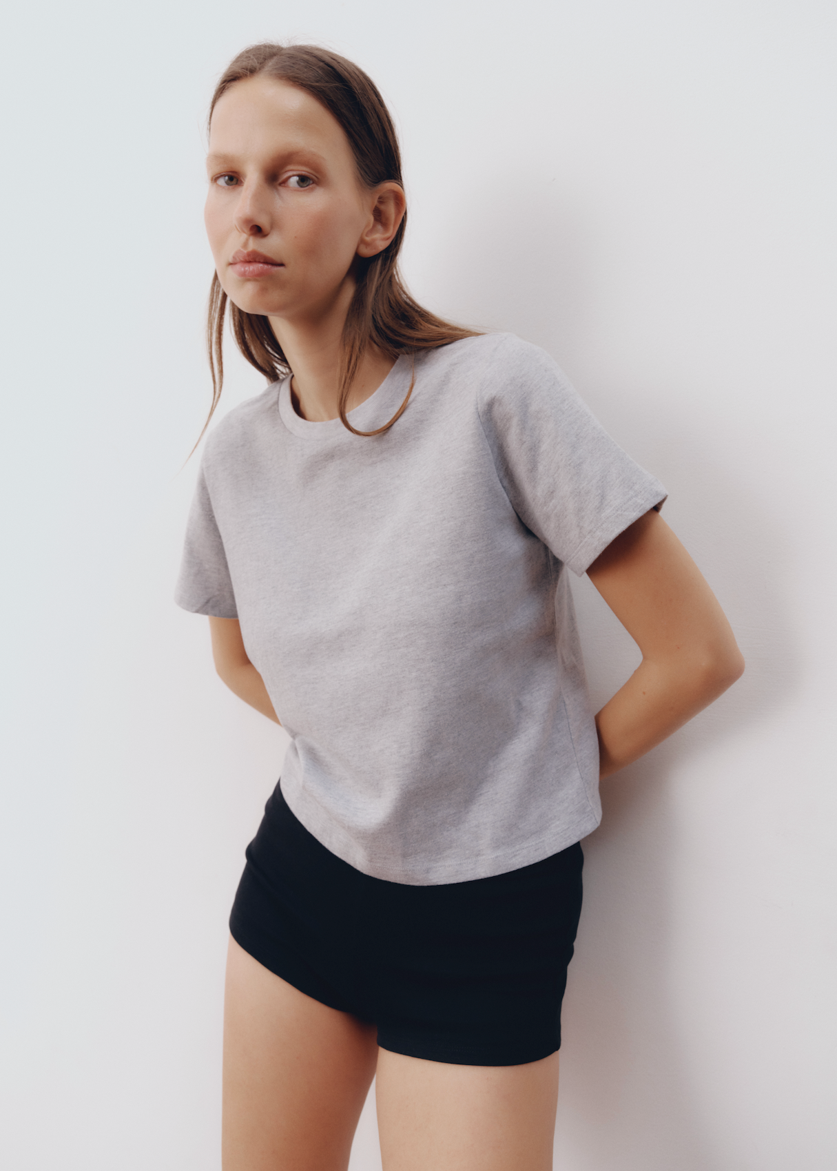 Model wearing Hunter Top in Light Heather Grey — lightweight boxy cotton tee, All My Love
