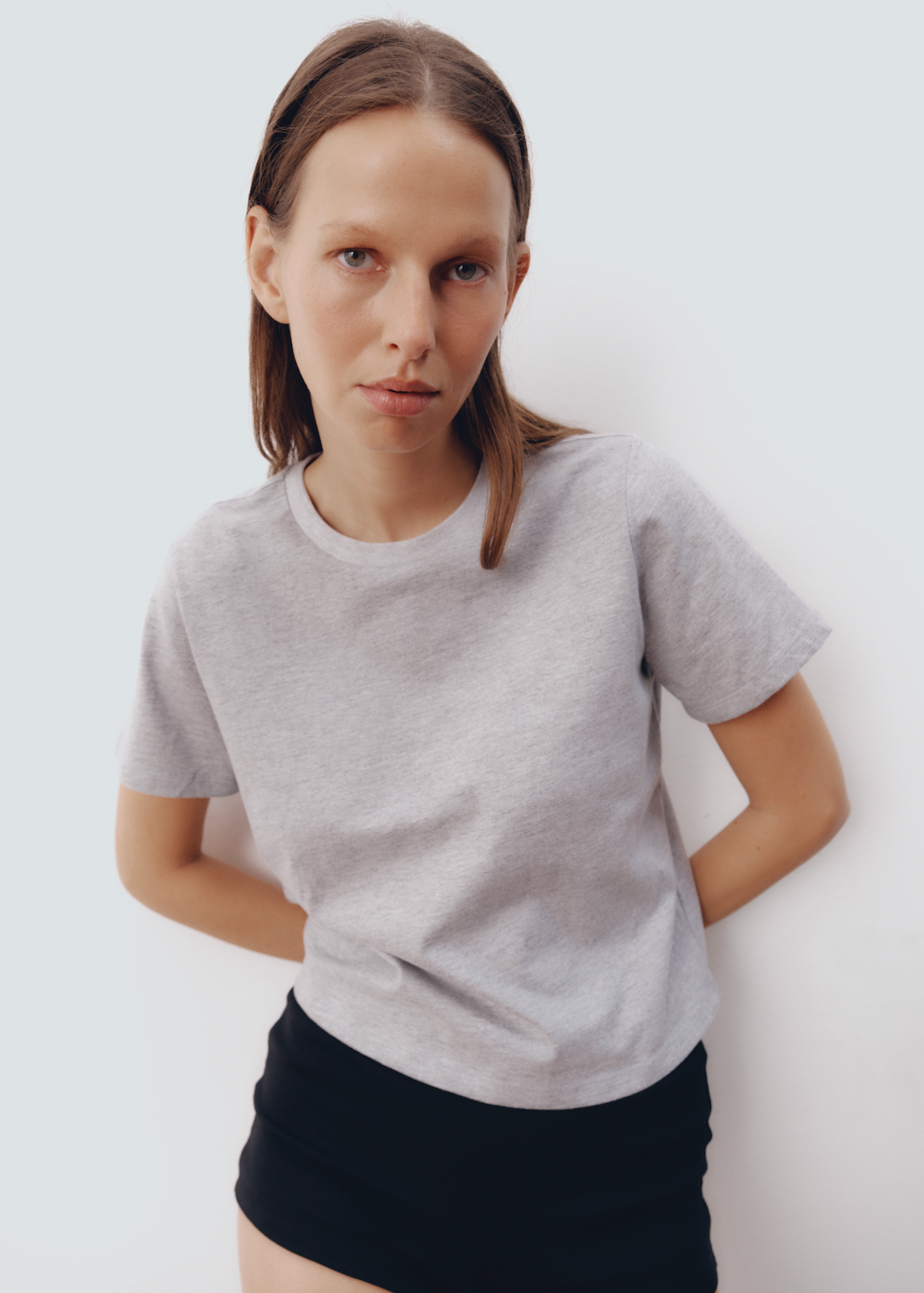 Model wearing Hunter Top in Light Heather Grey — lightweight boxy cotton tee, All My Love
